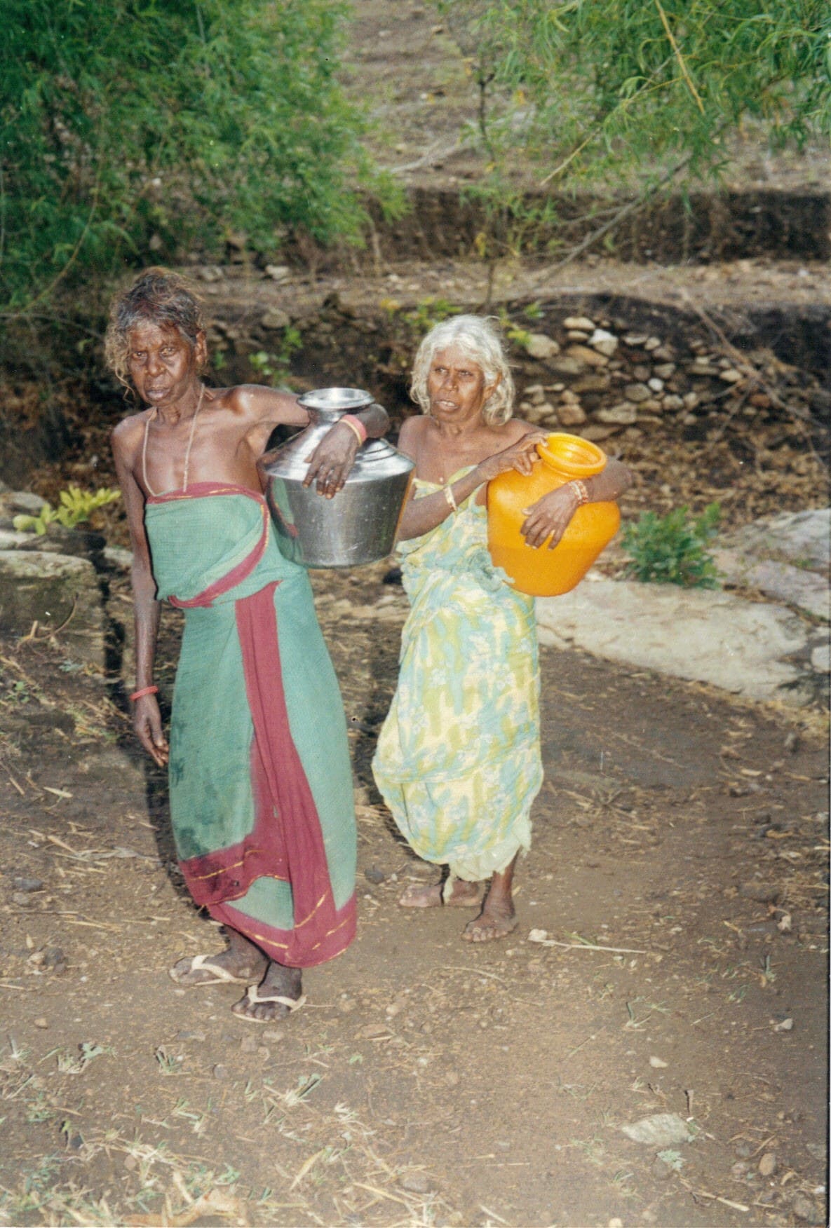 Tribal woment carrying water